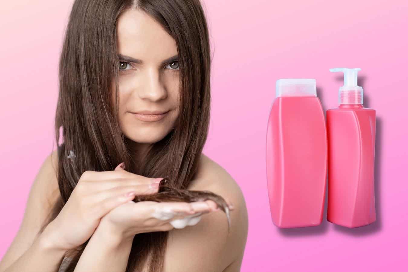 woman standing with product in her hair and a bottle of conditioner