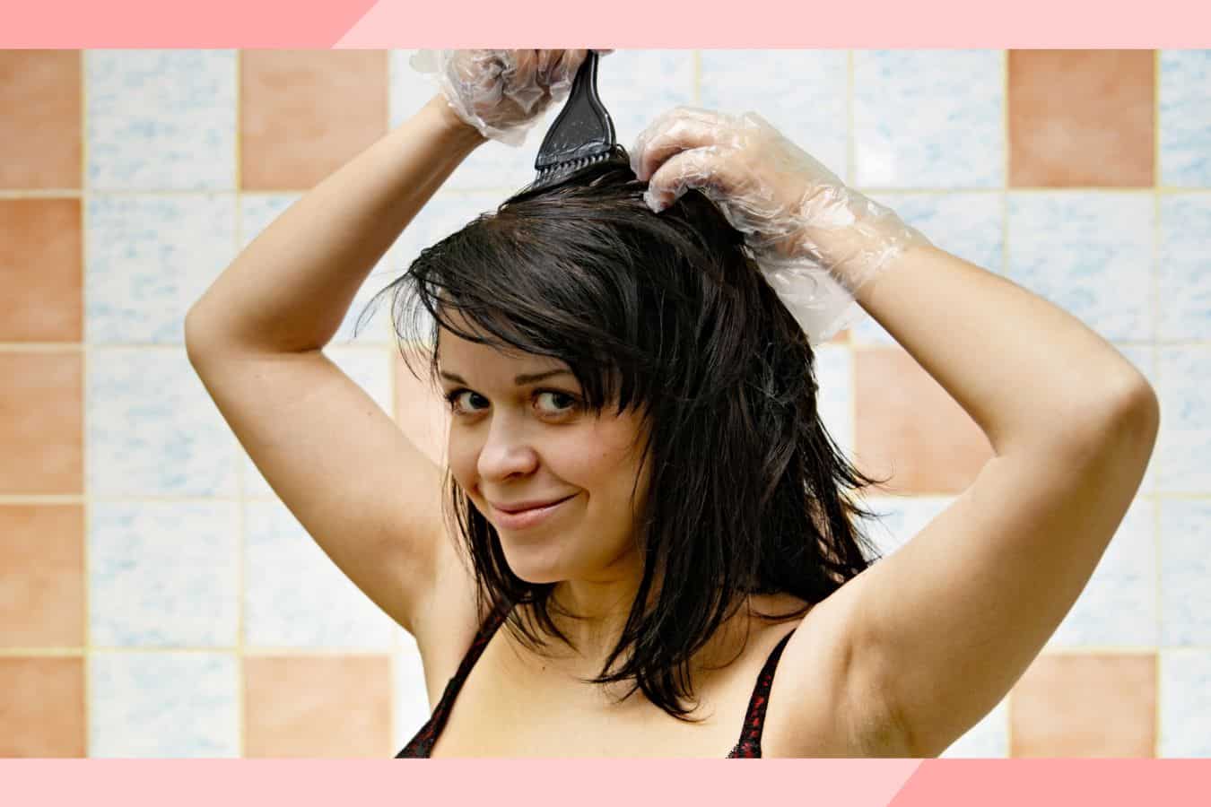 woman with black hair dyeing her hair.