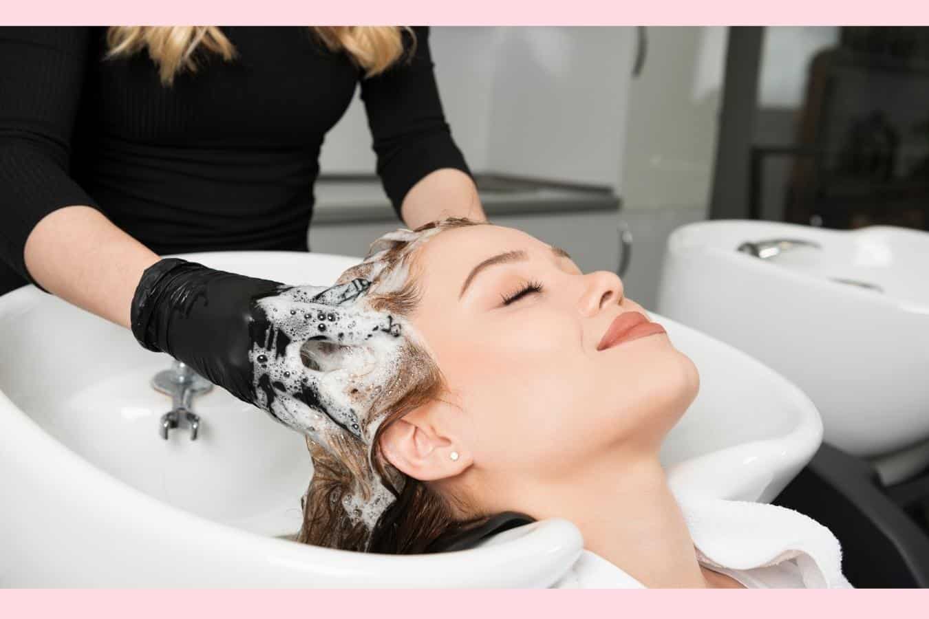 woman getting her hair washed at a salon